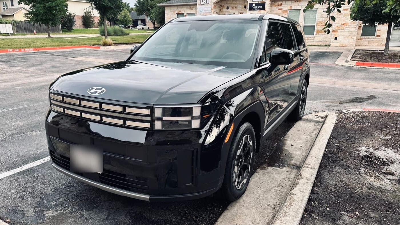 A black SUV from the Echo rental fleet in a parking lot